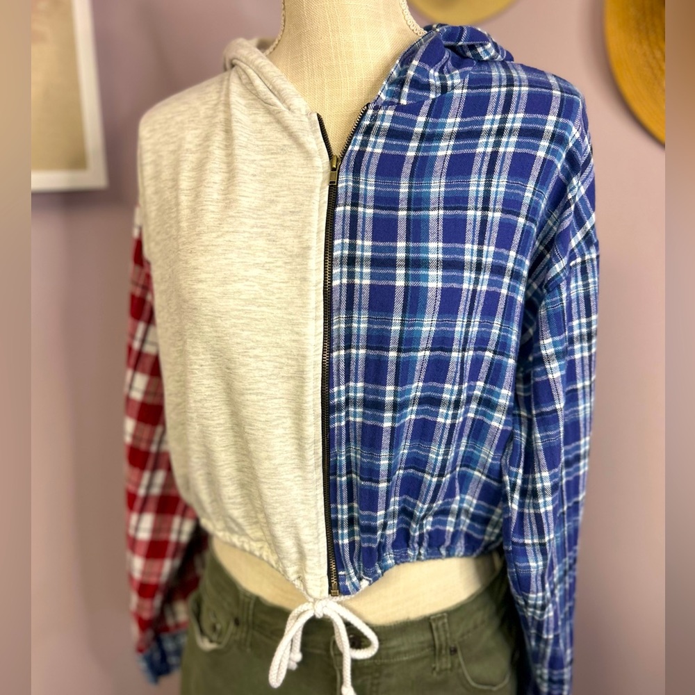 Win Win size large long sleeve cropped plaid jacket with a hood.